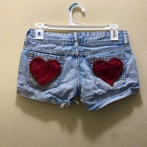 REWORKED VINTAGE RUE21 Blue denim shorts with red heart patches
